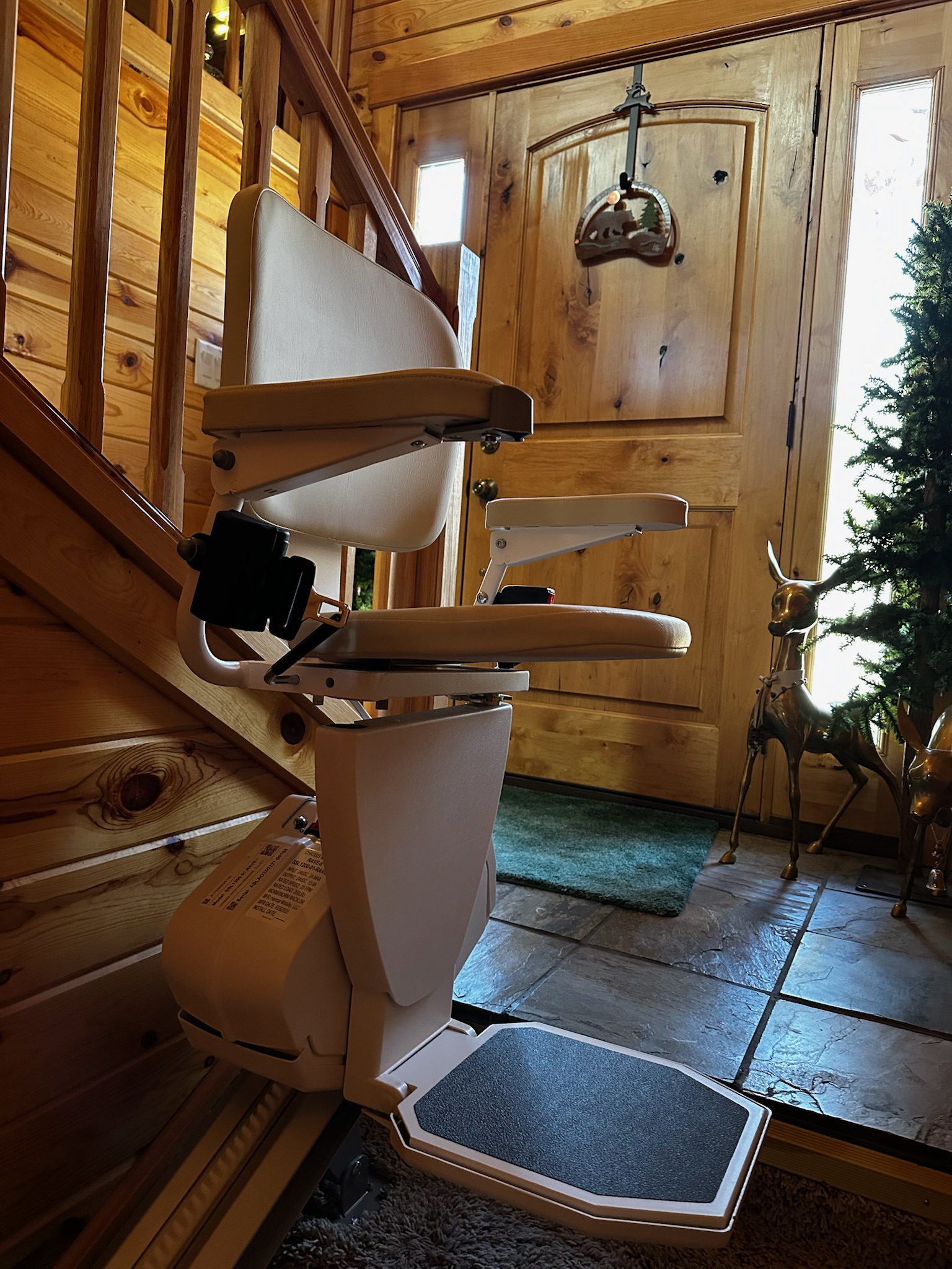 Western Stairlifts technician installing a stairlift in a Utah home