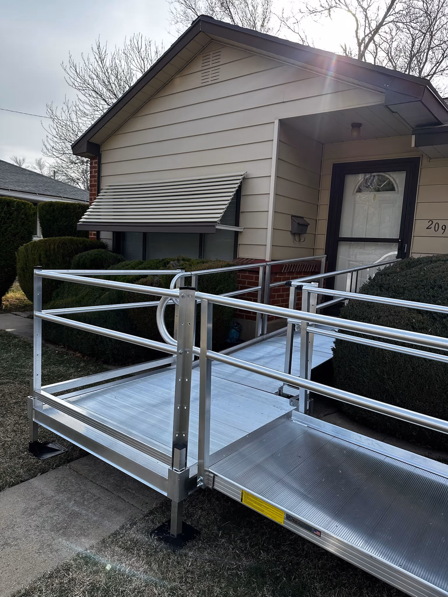 ADA-compliant handrail detail on an aluminum wheelchair ramp